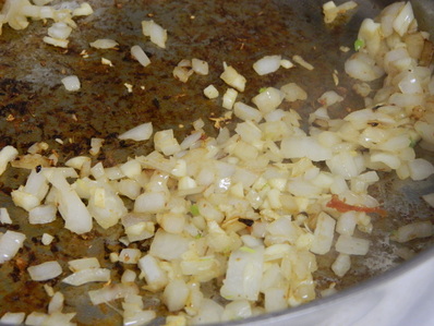 A one-pot Chile verde pork stew with steamed white rice Chile Verde con Carne (Chile Verde With Meat)