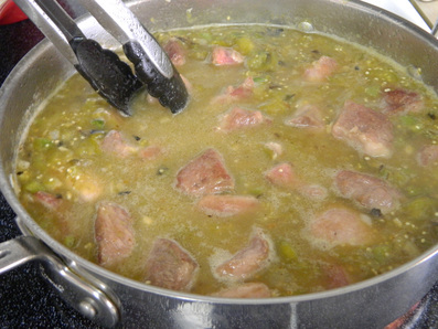 A one-pot Chile verde pork stew with steamed white rice Chile Verde con Carne (Chile Verde With Meat)
