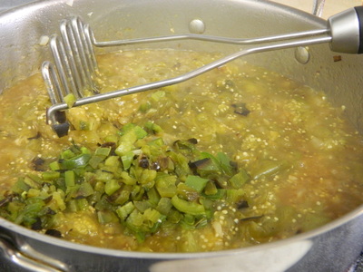 A one-pot Chile verde pork stew with steamed white rice Chile Verde con Carne (Chile Verde With Meat)