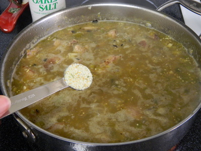 A one-pot Chile verde pork stew with steamed white rice Chile Verde con Carne (Chile Verde With Meat)