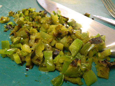 A one-pot Chile verde pork stew with steamed white rice Chile Verde con Carne (Chile Verde With Meat)