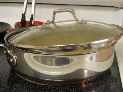 A one-pot Chile verde pork stew with steamed white rice Chile Verde con Carne (Chile Verde With Meat)