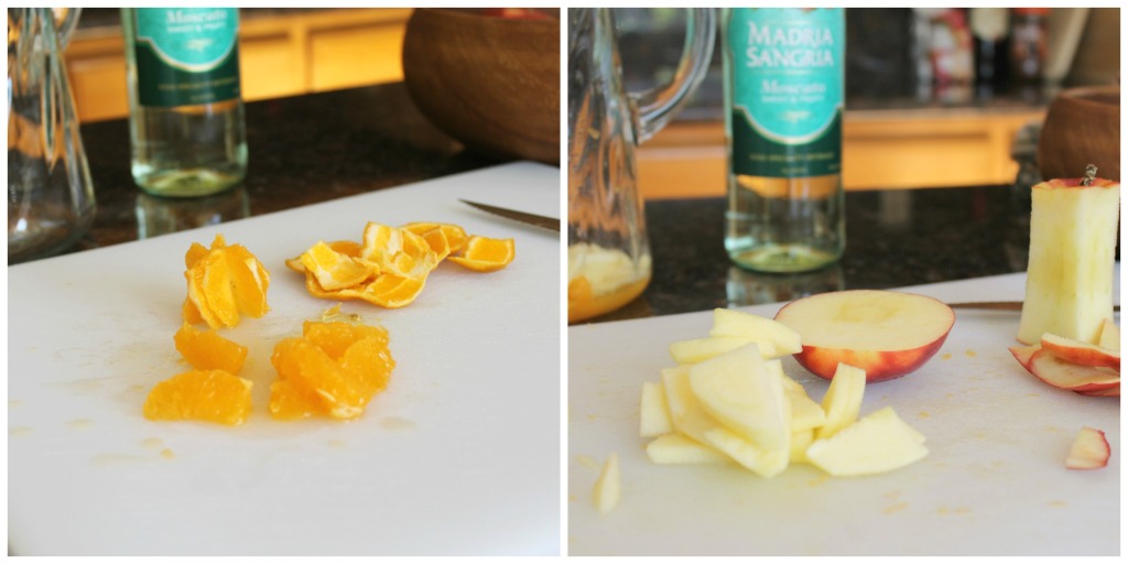 How to make a basic white wine sangria via SpanglishSpoon.com Peeled and slice oranges and apples on a cutting board.