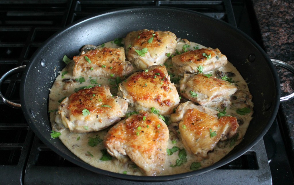 Pan-fried chicken thighs in mushroom sauce