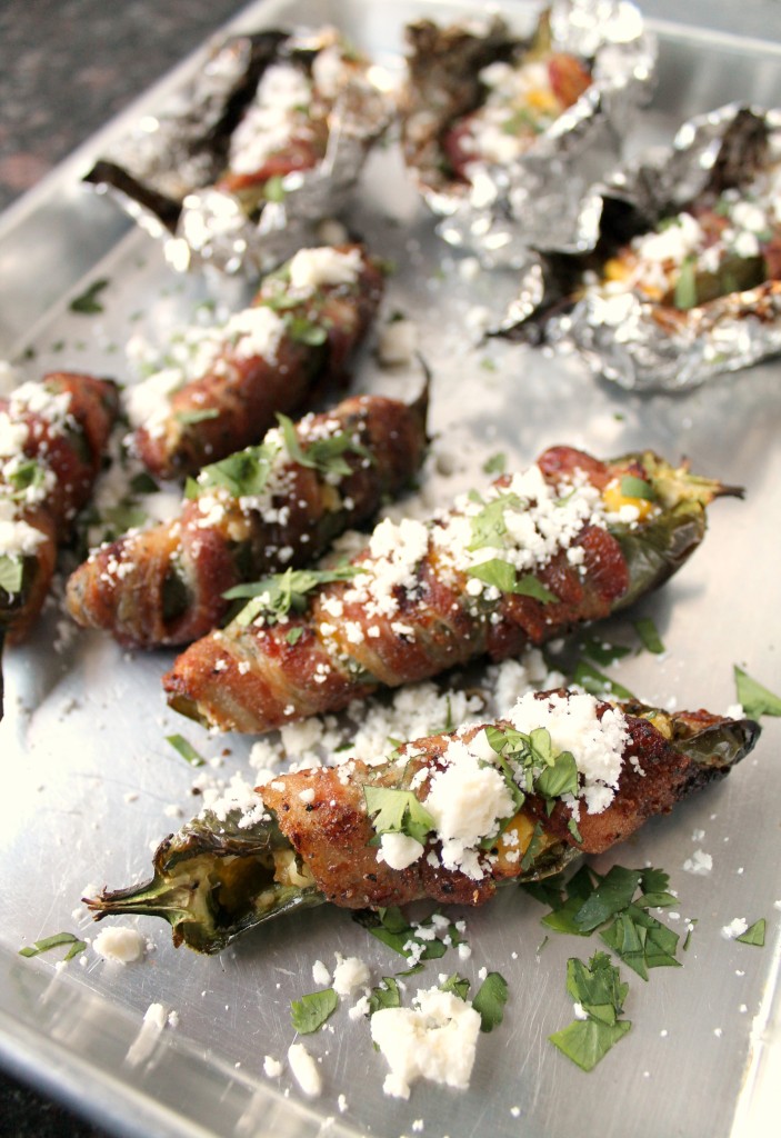 Barbecued bacon wrapped Jalapeño poppers with feta, corn, and cilantro. Bacon wrapped jalapenos with corn and feta cheese 15