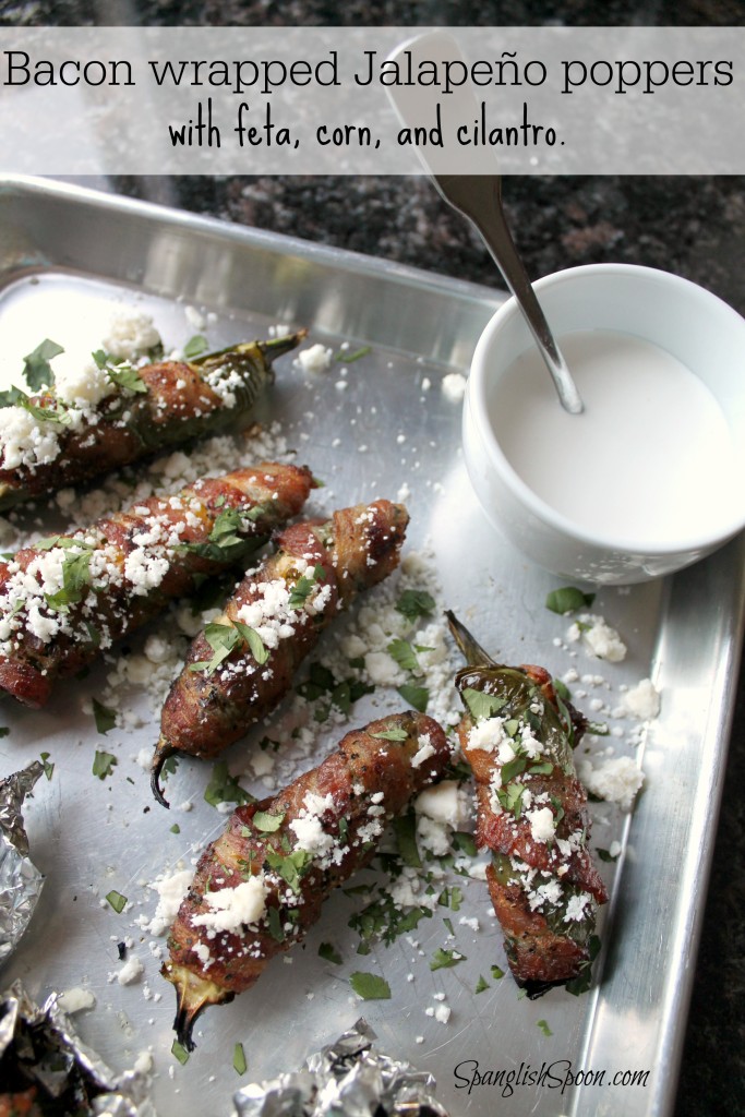 Barbecued bacon wrapped Jalapeño poppers with feta, corn, and cilantro. Bacon wrapped jalapenos with corn and feta cheese 18.2