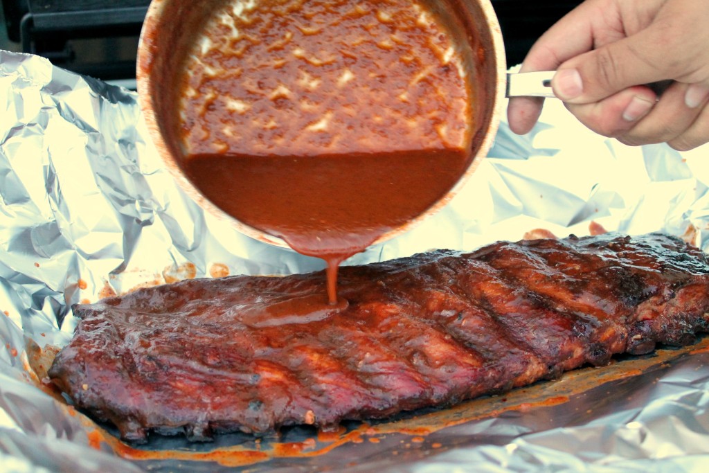 Homemade barbecue sauce on smoked ribs 10