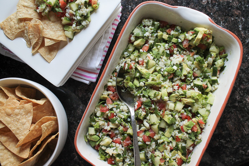 30-minute white fish ceviche recipe Large batch of ceviche served in a baking dish with tortilla chips on the side.
