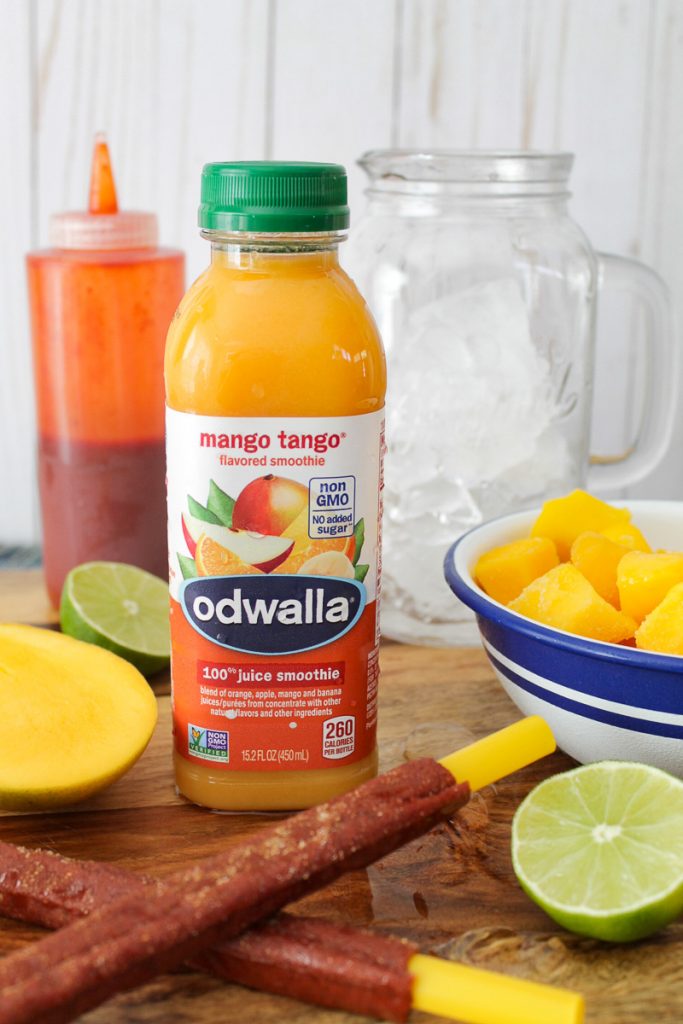 How To Make a Mangonada Ingredients for a mangonada on a cutting board.