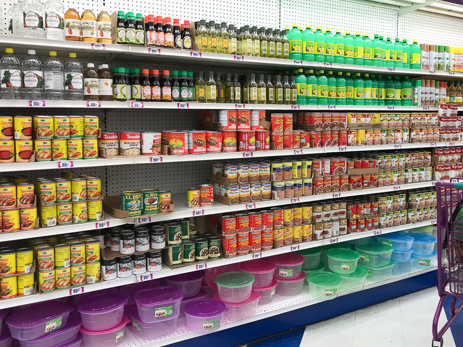 Grocery store shelves with condiments.