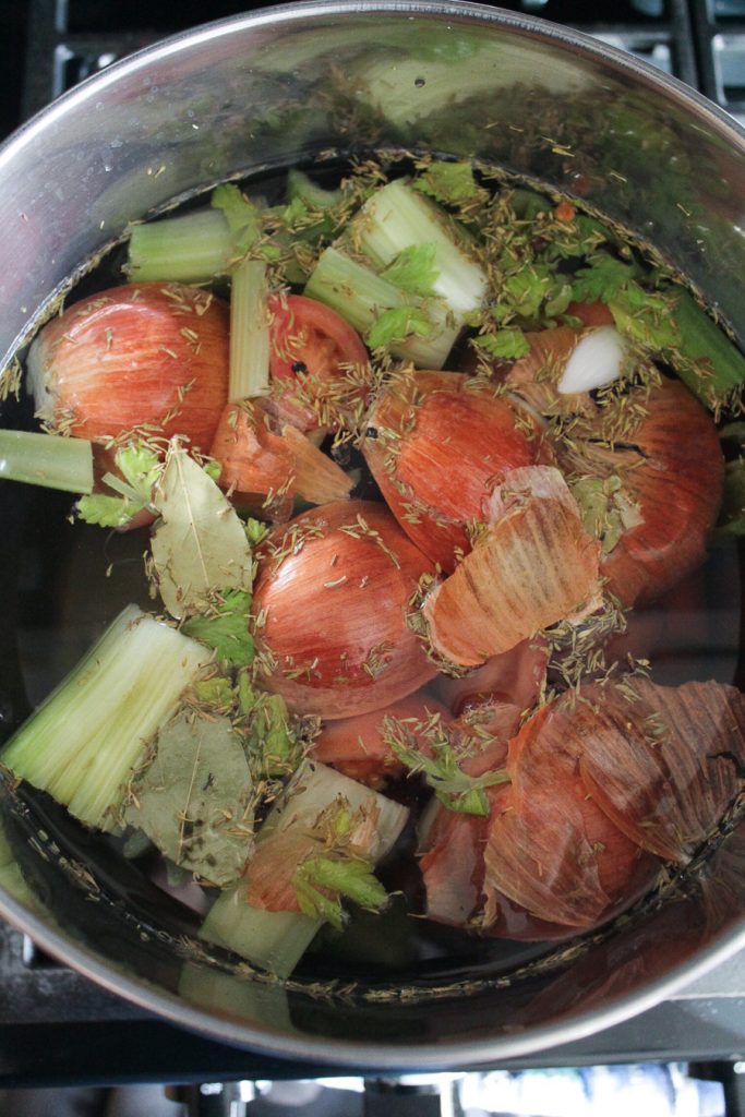 Vegetables boiling in a pot to make vegetable broth.